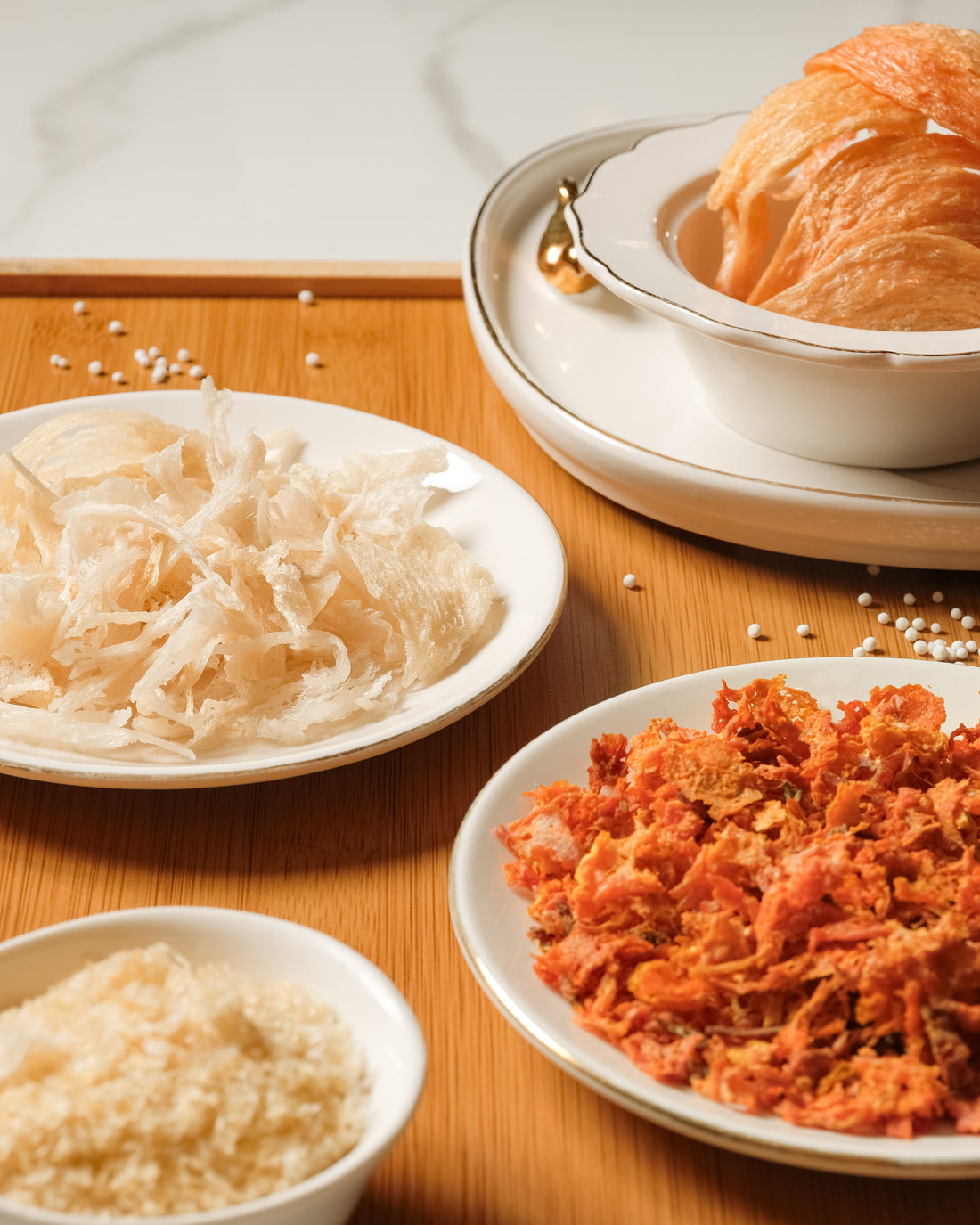 White strips, red nest and whole bird's nest cups compared on a tray at JUMAMA
